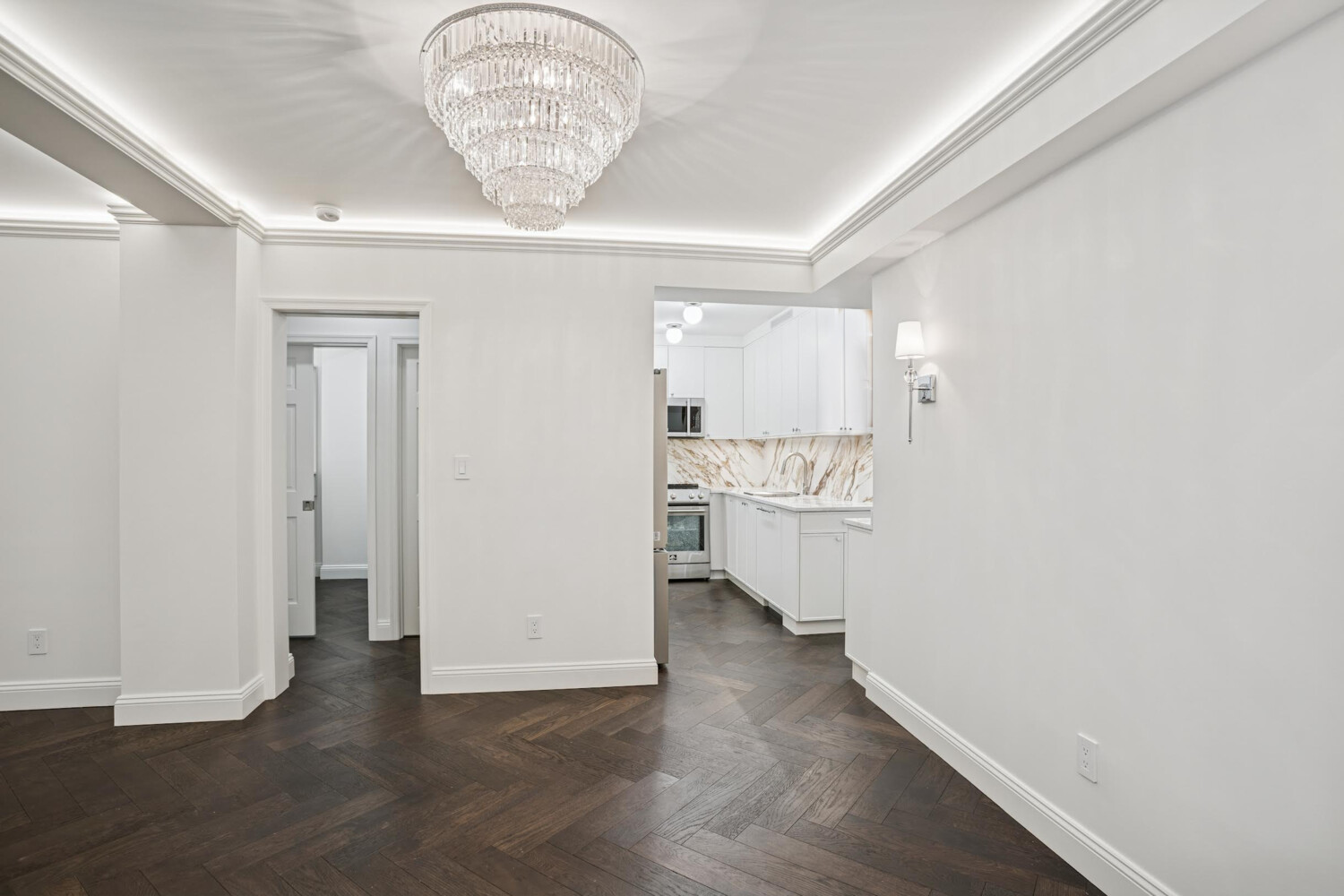 116 East 66th Street, Unit 3E Manhattan, NY 10065 - Photo 3 of 10 a view of a kitchen with a sink and a refrigerator
