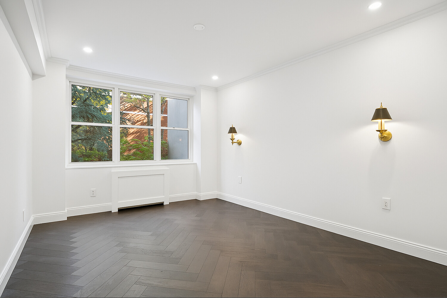 116 East 66th Street, Unit 3E Manhattan, NY 10065 - Photo 7 of 10 an empty room with windows