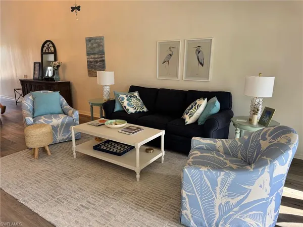 a living room with furniture a rug and a couch