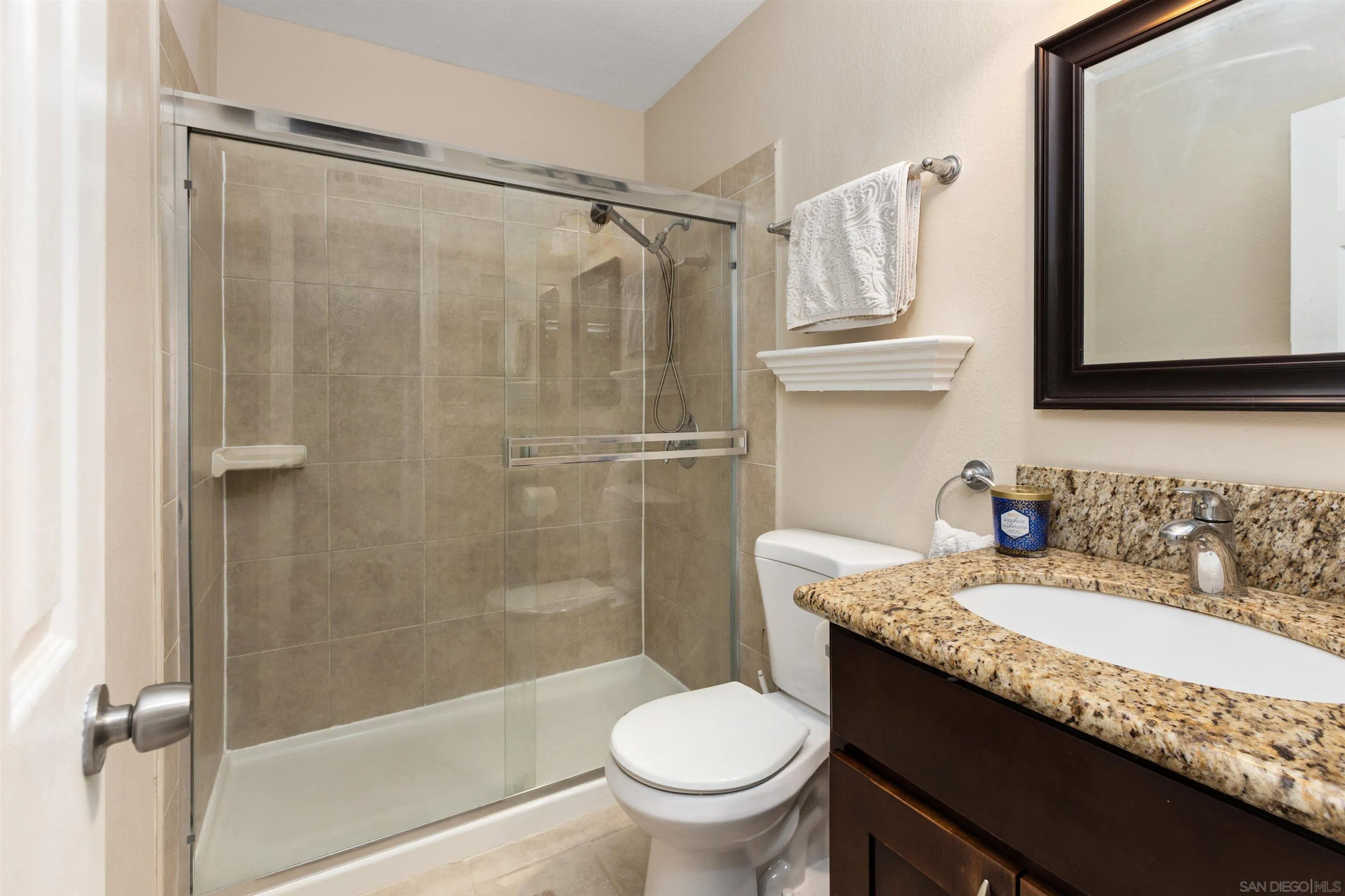 8963 Capcano Road San Diego, CA 92126 - Photo 30 of 38 Hall bath with shower and glass door
