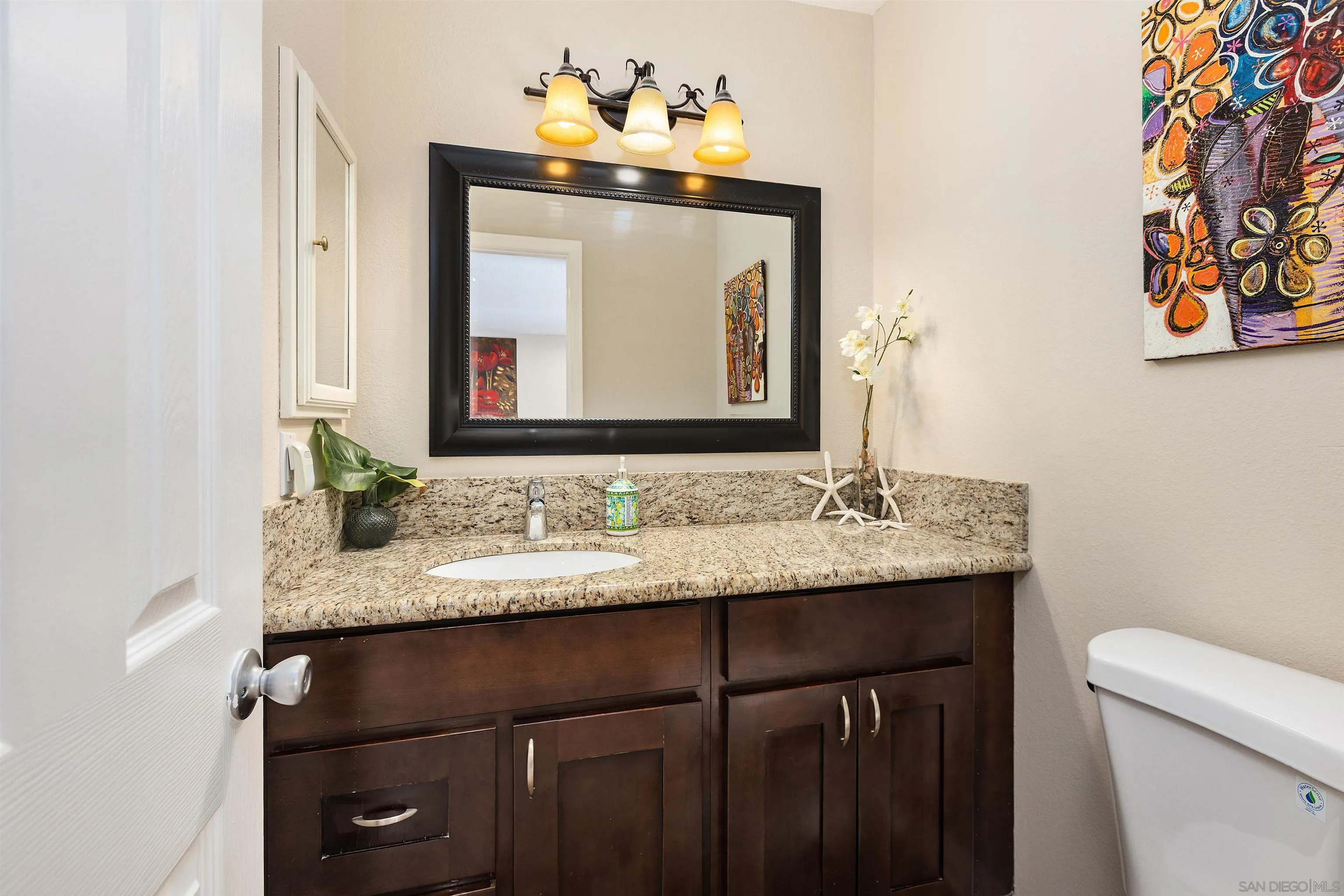 8963 Capcano Road San Diego, CA 92126 - Photo 6 of 38 powder room / half bath on 1st floor