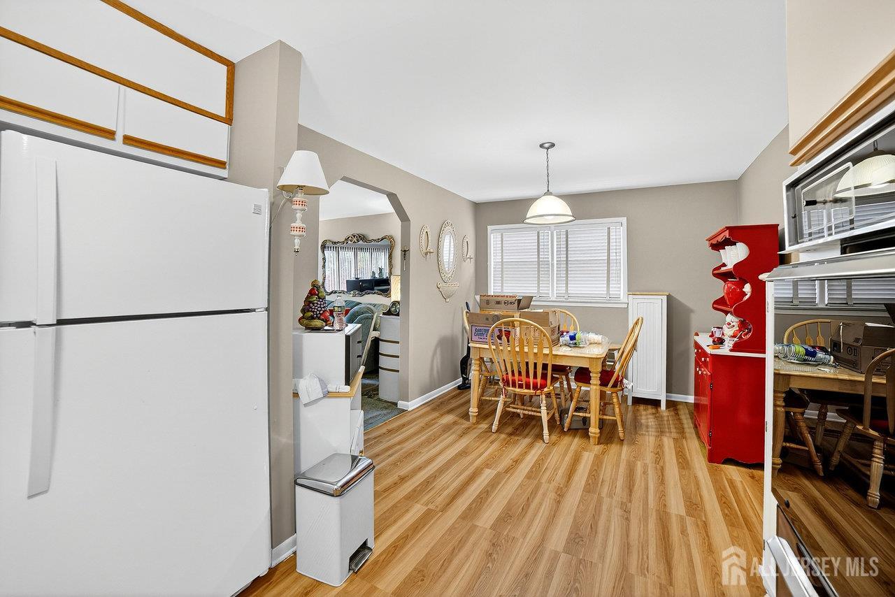 307 Sutton Street Perth Amboy, NJ 08861 - Photo 15 of 27 a dining room with furniture and wooden floor