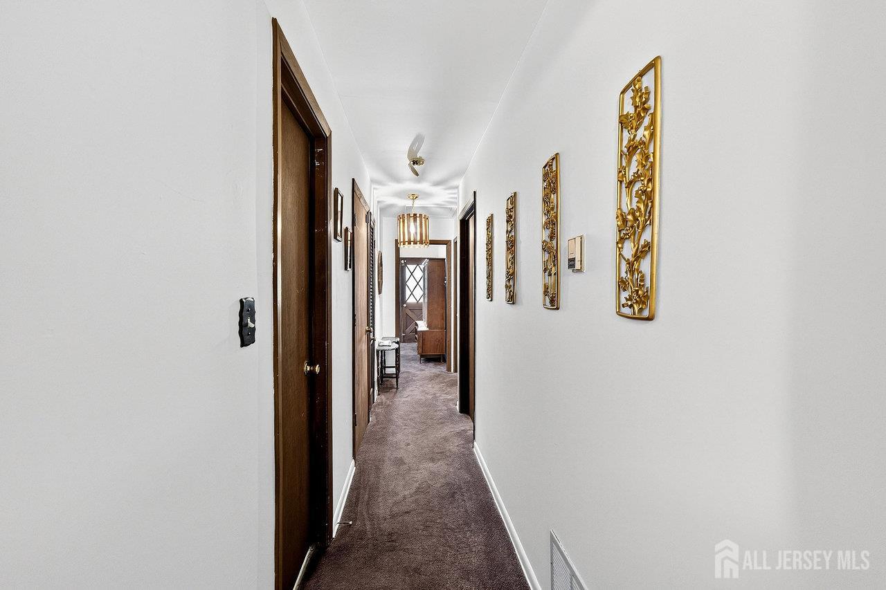 307 Sutton Street Perth Amboy, NJ 08861 - Photo 16 of 27 a view of a hallway with interior of the house