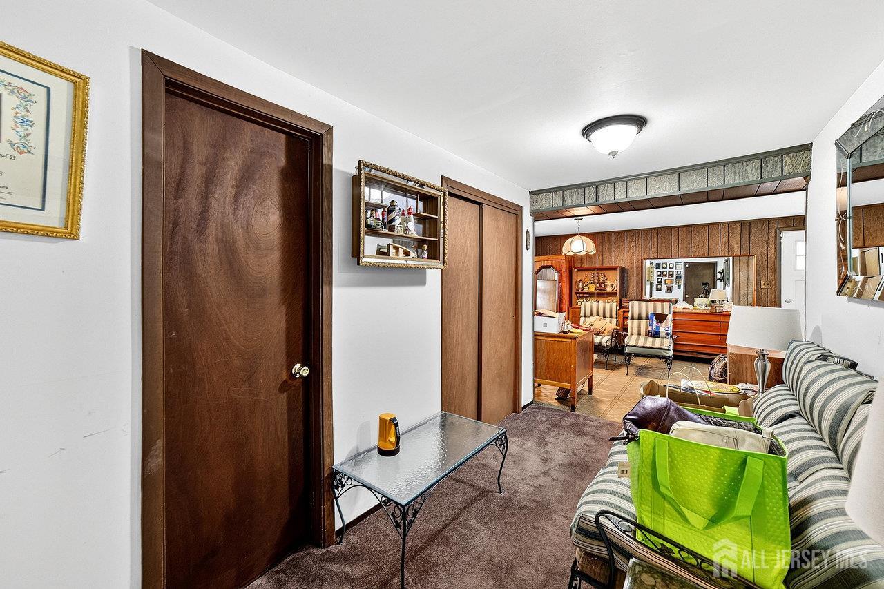 307 Sutton Street Perth Amboy, NJ 08861 - Photo 21 of 27 a living room with furniture and a large window