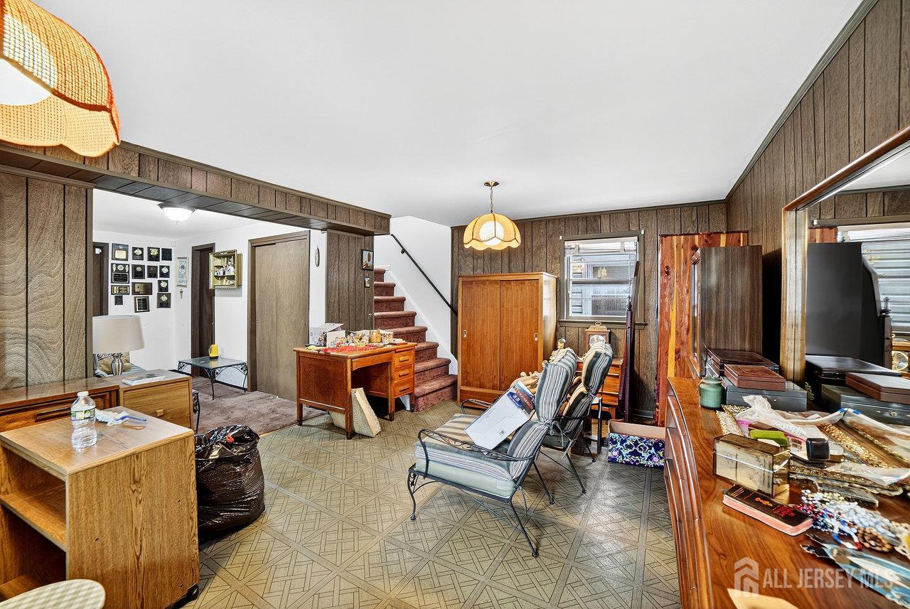 307 Sutton Street Perth Amboy, NJ 08861 - Photo 22 of 27 a living room with furniture and a flat screen tv