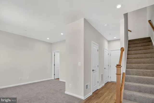 a view of entryway with stairs and wooden floor