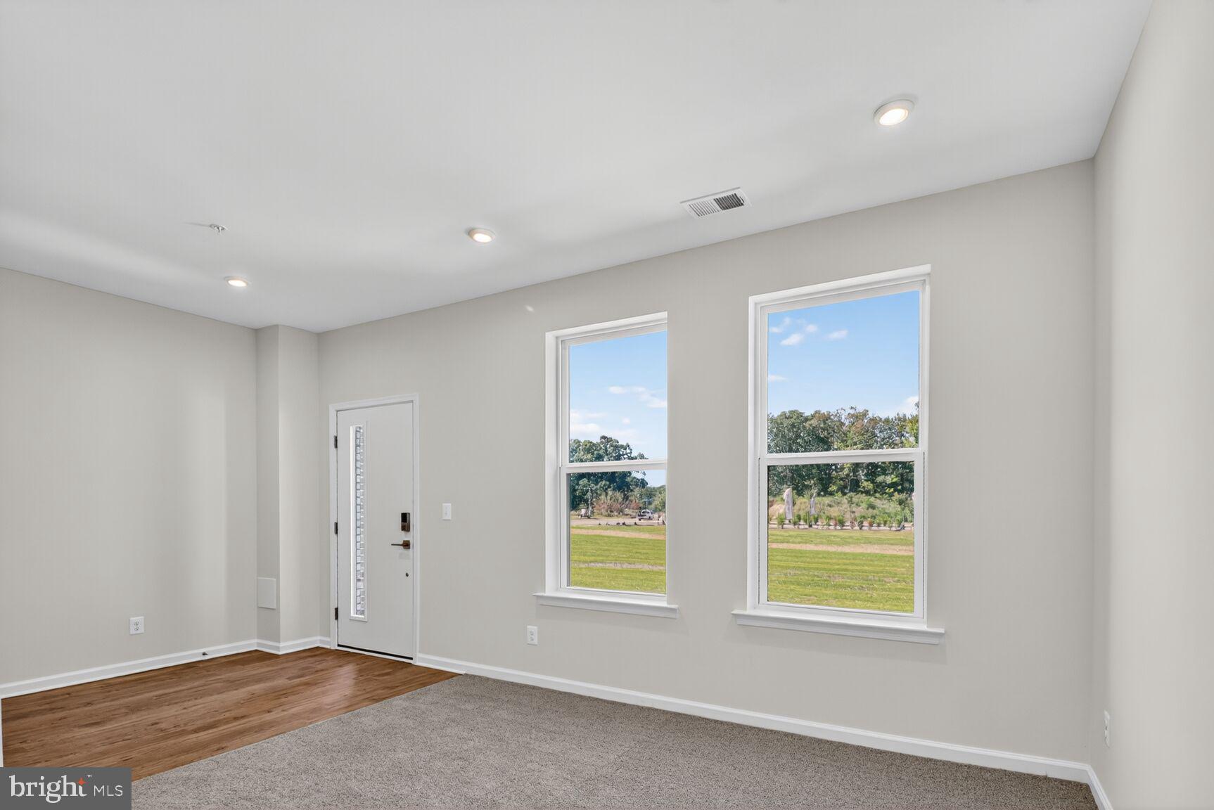 1802 John Stricker Avenue Baltimore, MD 21222 - Photo 4 of 47 a view of an empty room with a window