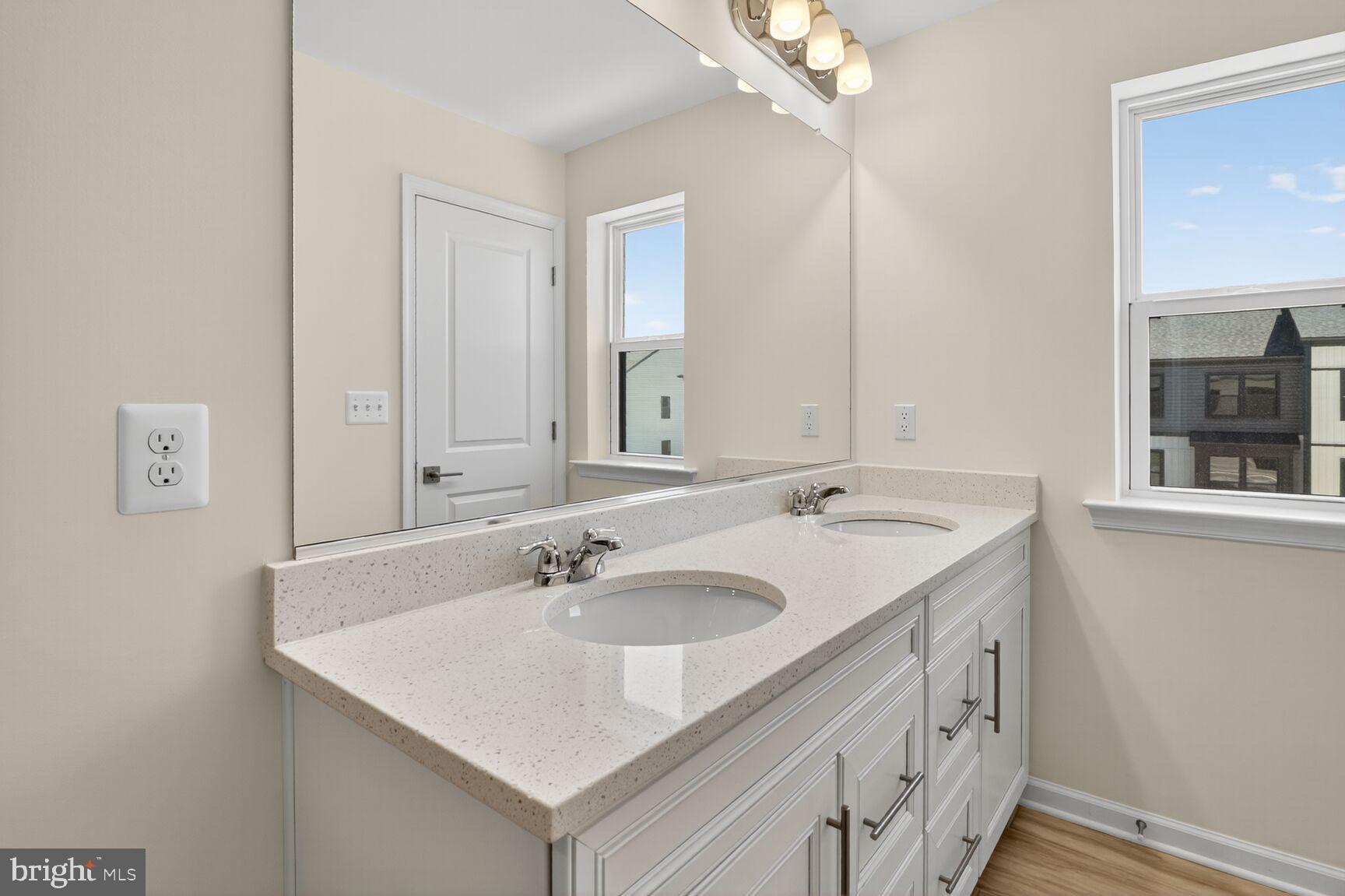 1802 John Stricker Avenue Baltimore, MD 21222 - Photo 10 of 47 a bathroom with a sink and a mirror