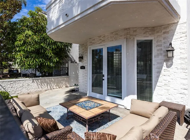 a outdoor living space with furniture and a potted plant