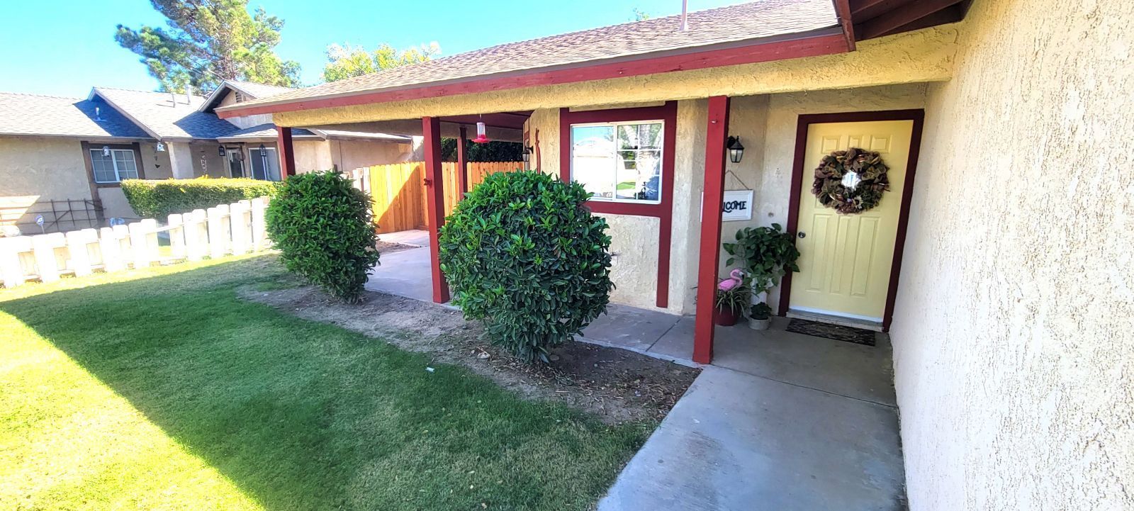 725 Ginger Avenue Ridgecrest, CA 93555 - Photo 2 of 29 a view of a front of a house with a porch