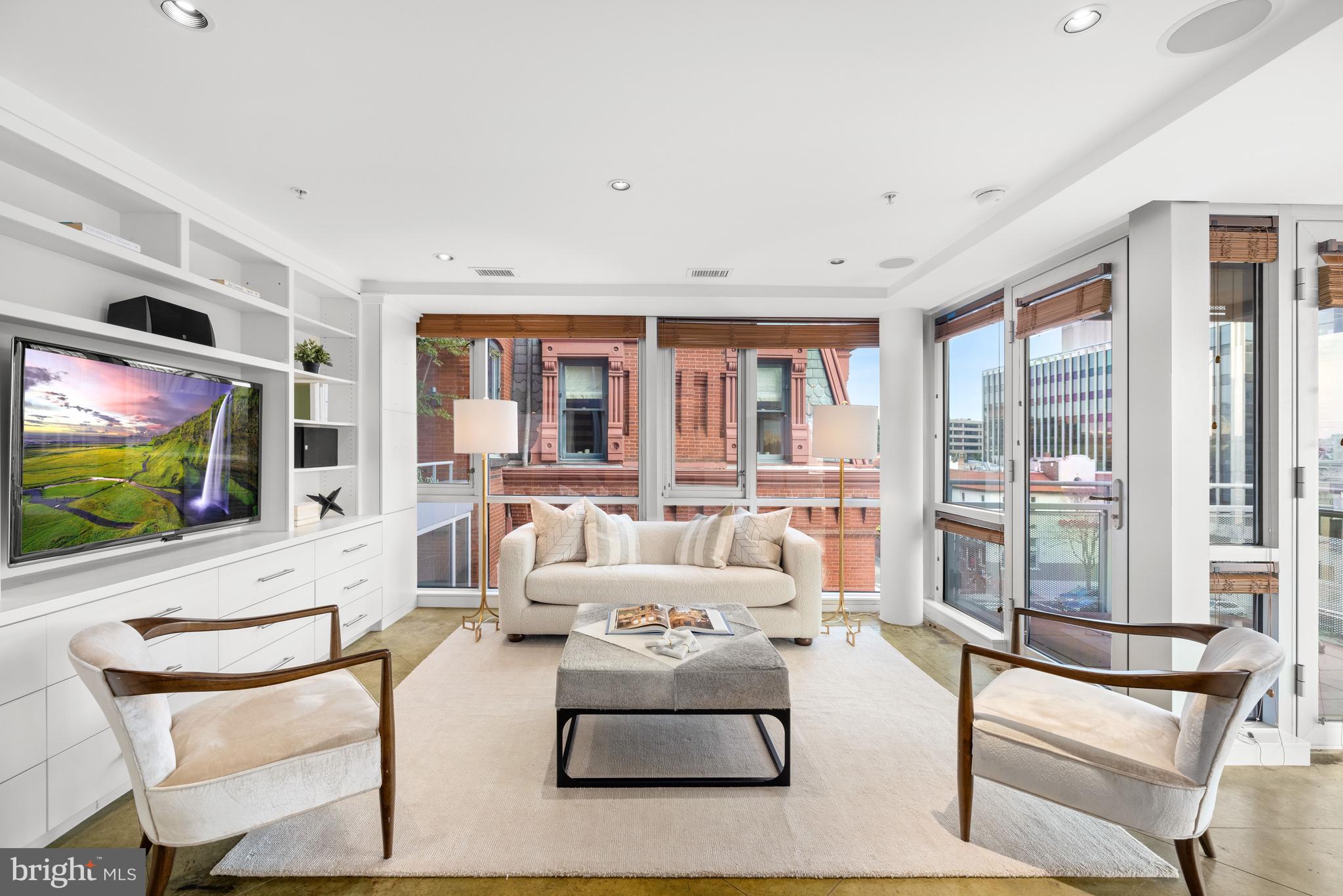 2002 Massachusetts Avenue Northwest, Unit R3 Washington, DC 20036 - Photo 11 of 27 a living room with furniture and a flat screen tv