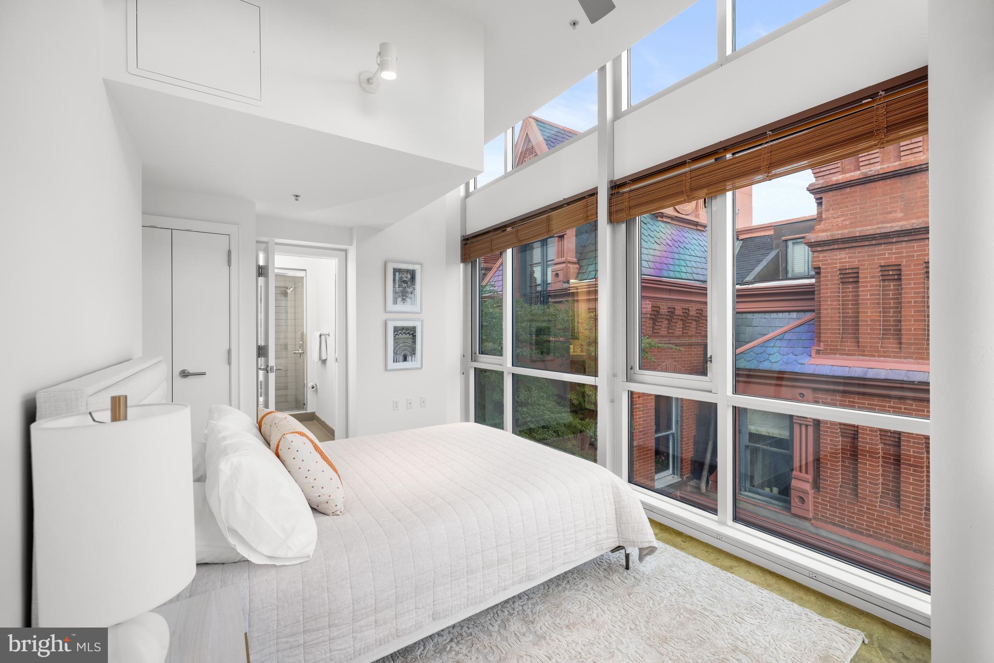 2002 Massachusetts Avenue Northwest, Unit R3 Washington, DC 20036 - Photo 20 of 27 a bed room with a bed and a large window