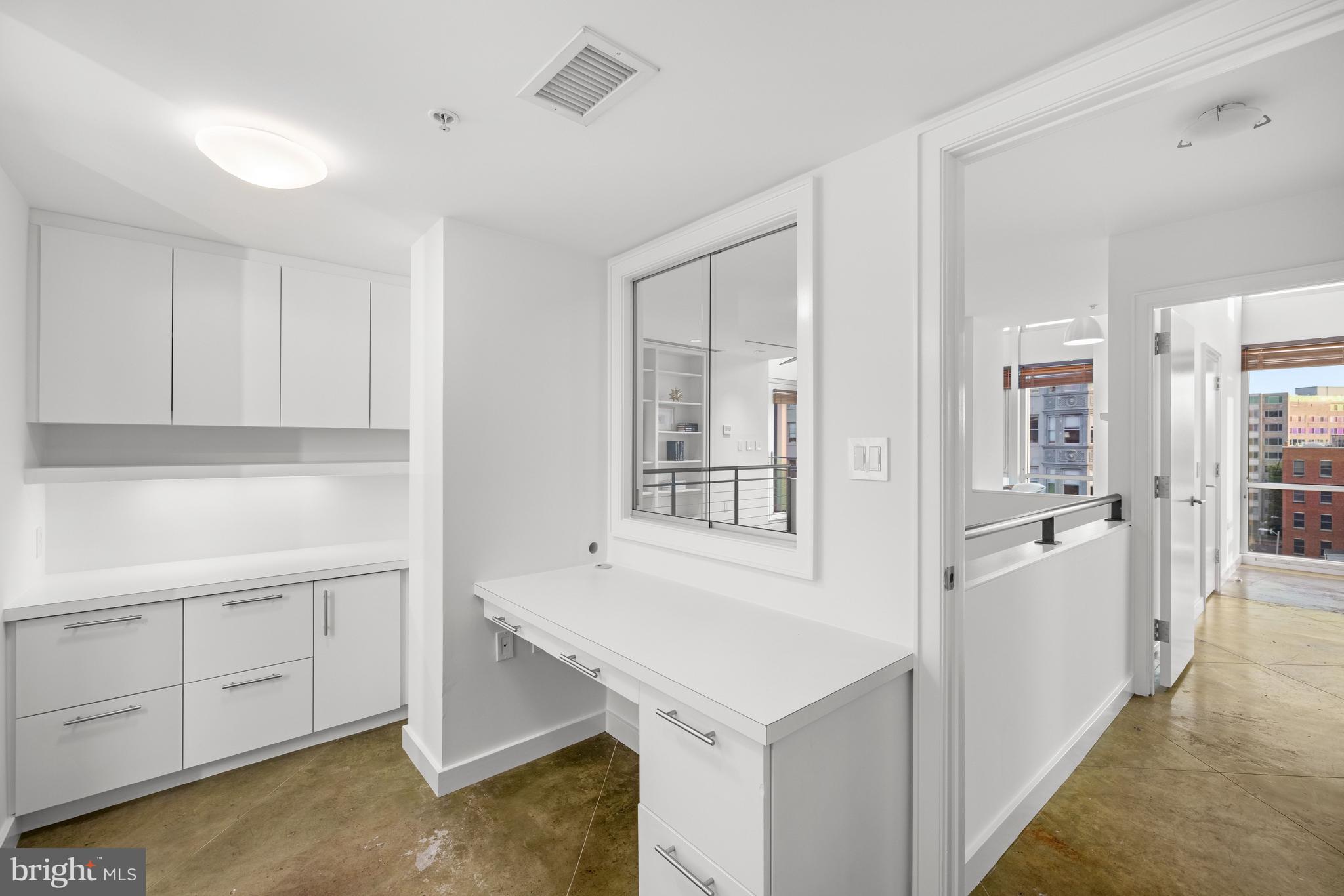 2002 Massachusetts Avenue Northwest, Unit R3 Washington, DC 20036 - Photo 24 of 27 a view of a kitchen with white cabinets