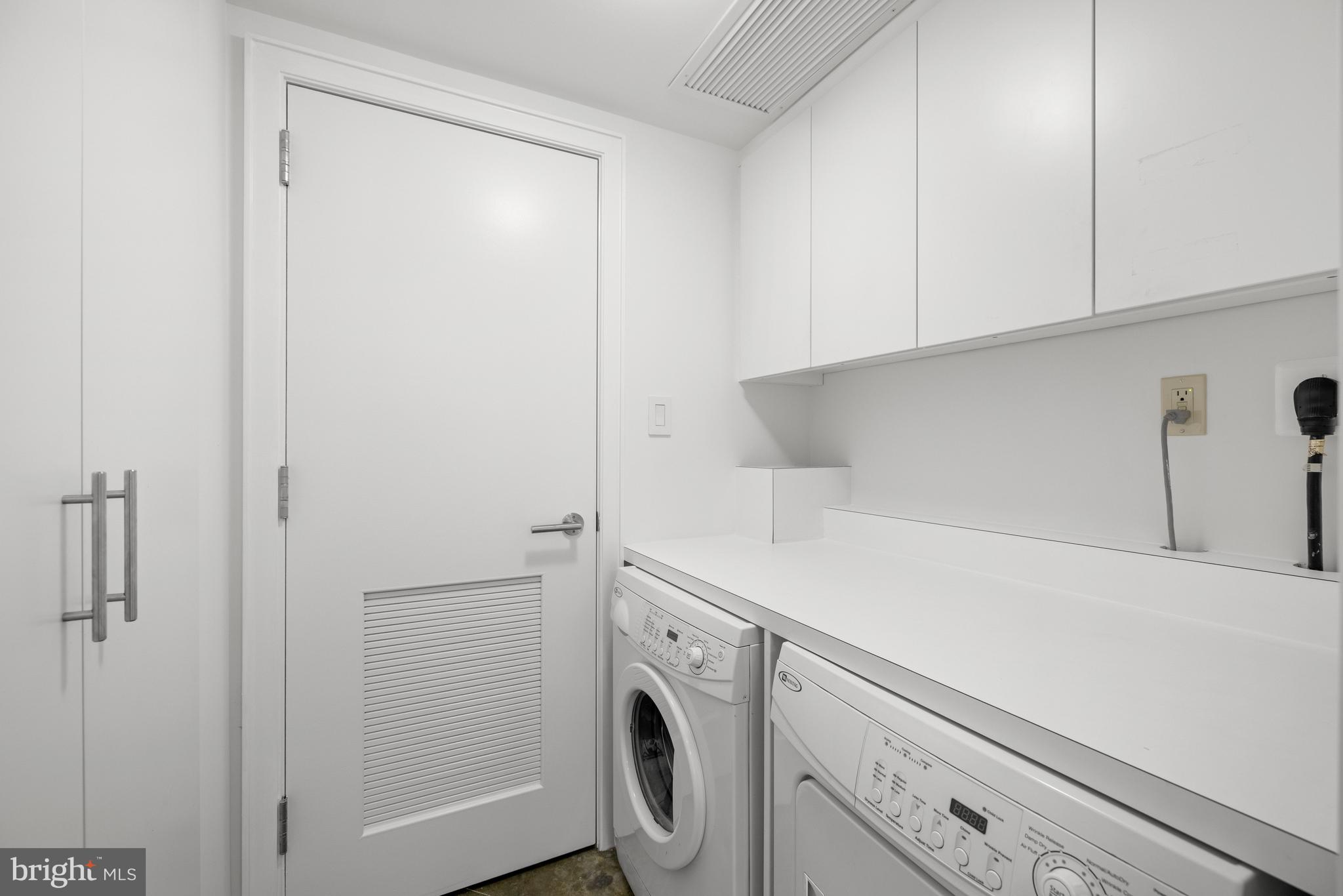 2002 Massachusetts Avenue Northwest, Unit R3 Washington, DC 20036 - Photo 25 of 27 a utility room with dryer and washer