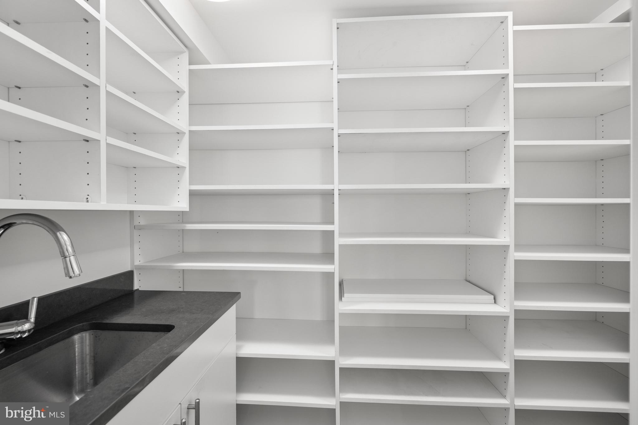 2002 Massachusetts Avenue Northwest, Unit R3 Washington, DC 20036 - Photo 5 of 27 a kitchen with a sink wooden floor and a window