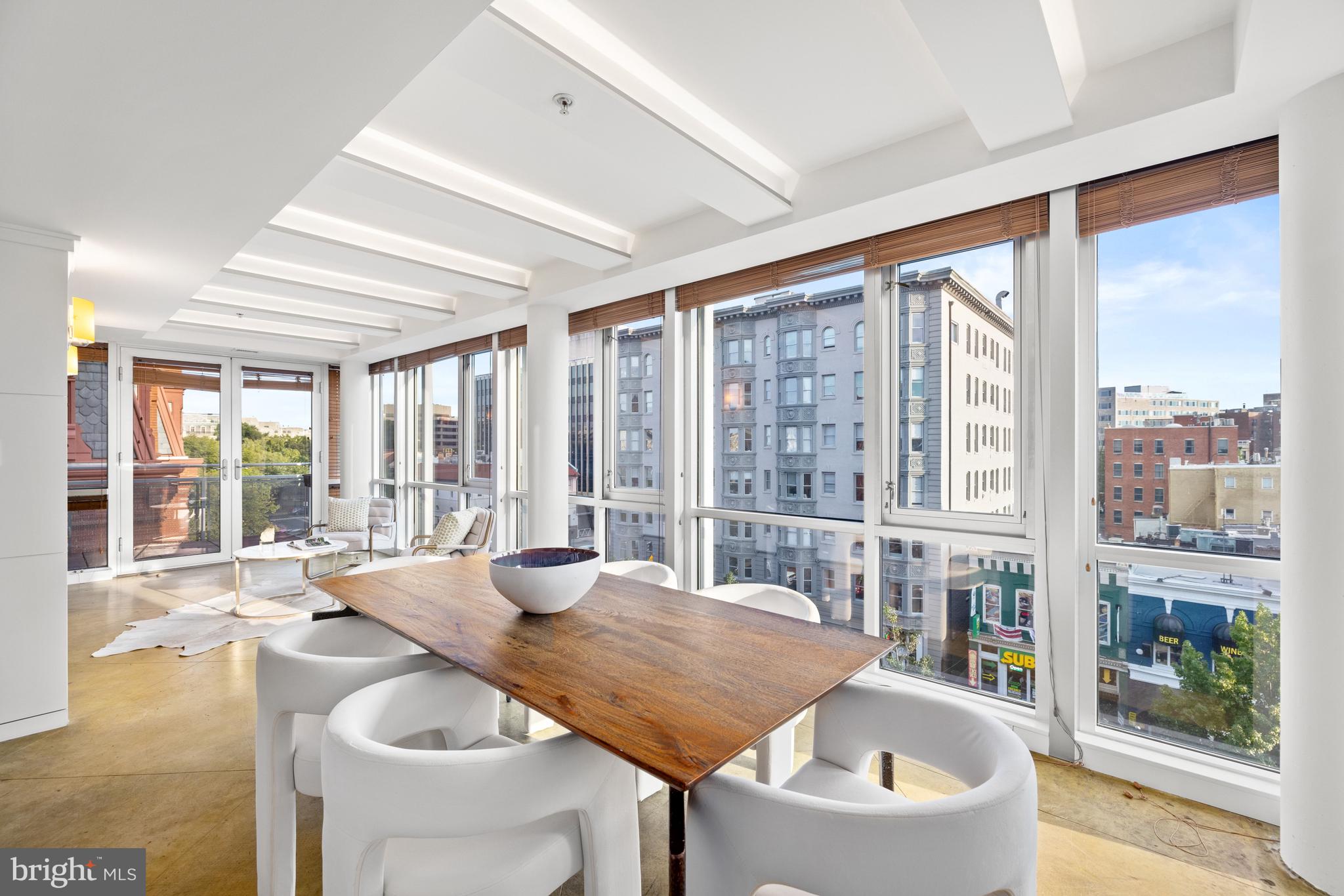 2002 Massachusetts Avenue Northwest, Unit R3 Washington, DC 20036 - Photo 6 of 27 a living room with furniture and a large window