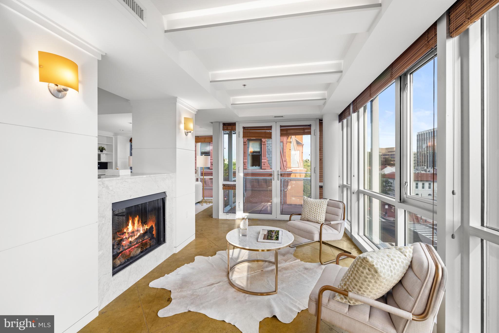 2002 Massachusetts Avenue Northwest, Unit R3 Washington, DC 20036 - Photo 9 of 27 a living room with furniture and a fireplace