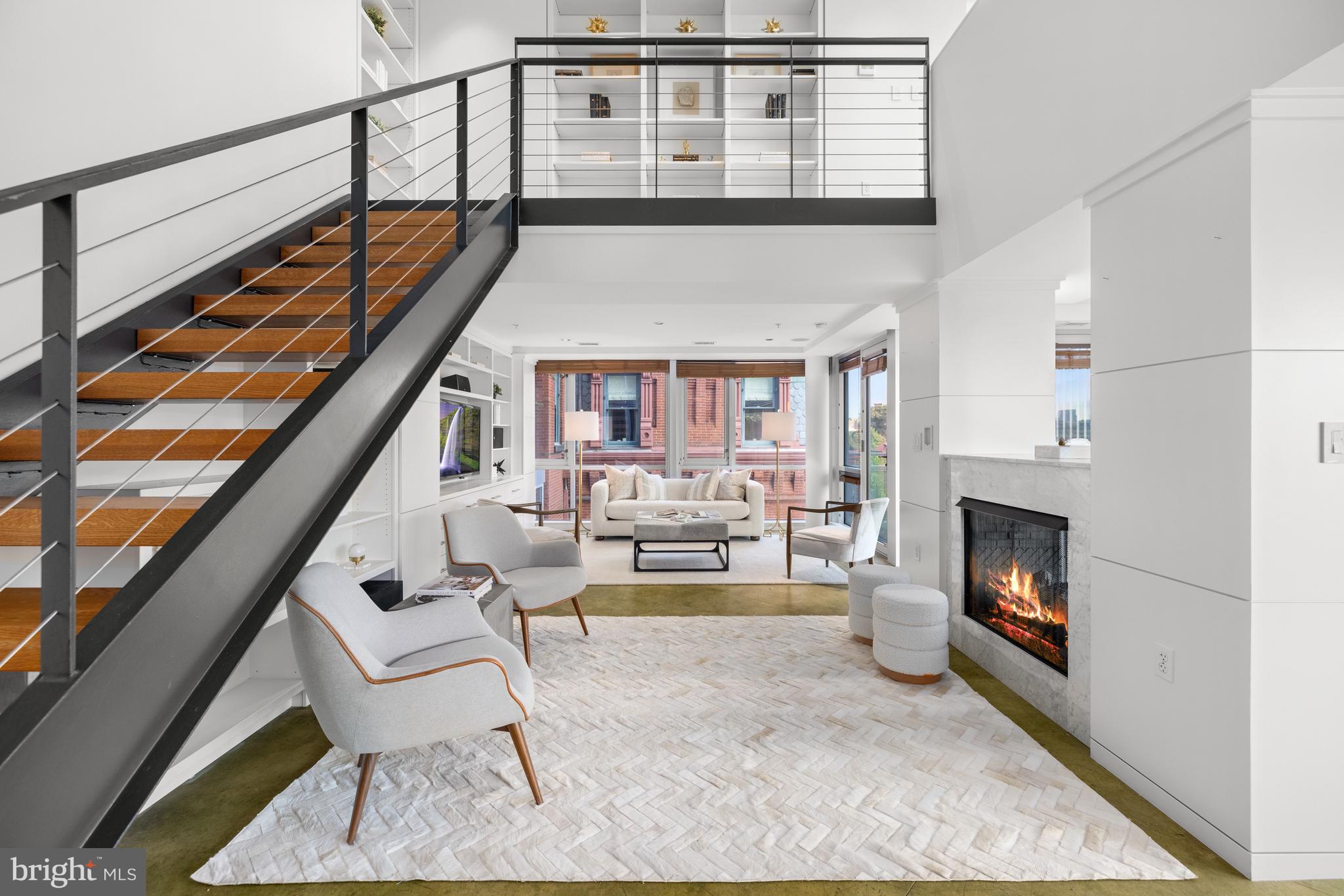 2002 Massachusetts Avenue Northwest, Unit R3 Washington, DC 20036 - Photo 10 of 27 a living room with furniture and a fireplace