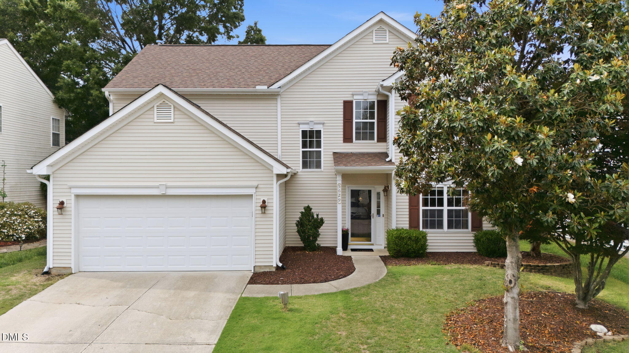 5629 Enoree Lane Raleigh, NC 27616 - Photo 1 of 38 a view of a white house next to a yard and a large tree