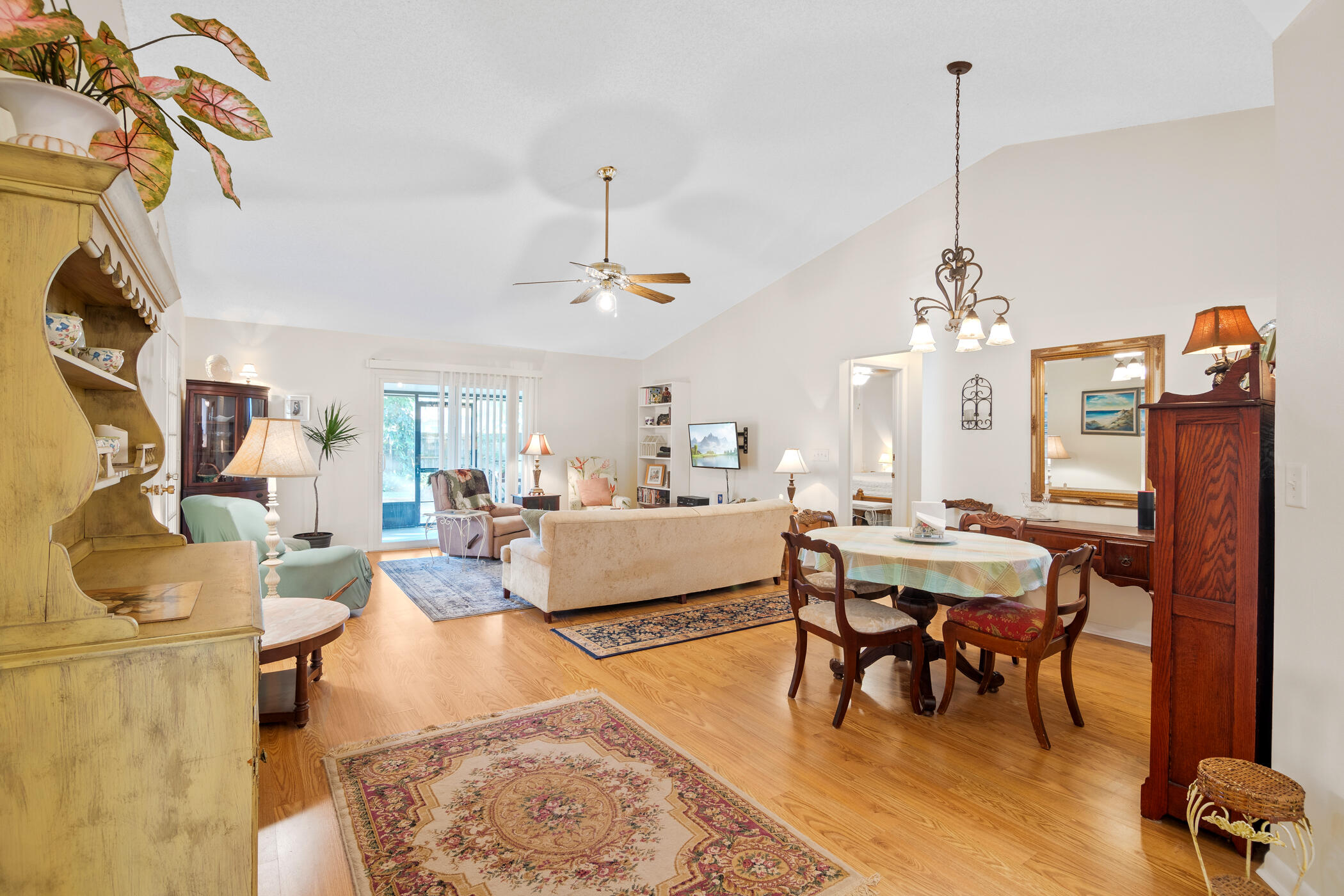 849 Gardener Road Rockledge, FL 32955 - Photo 7 of 31 a living room with furniture and a chandelier