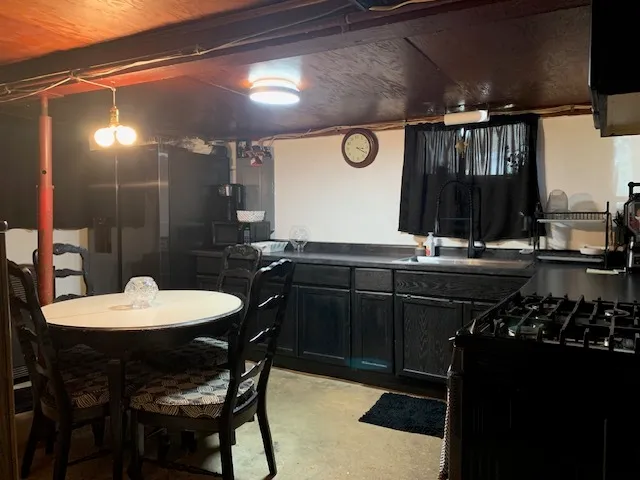 a kitchen with a sink and cabinets