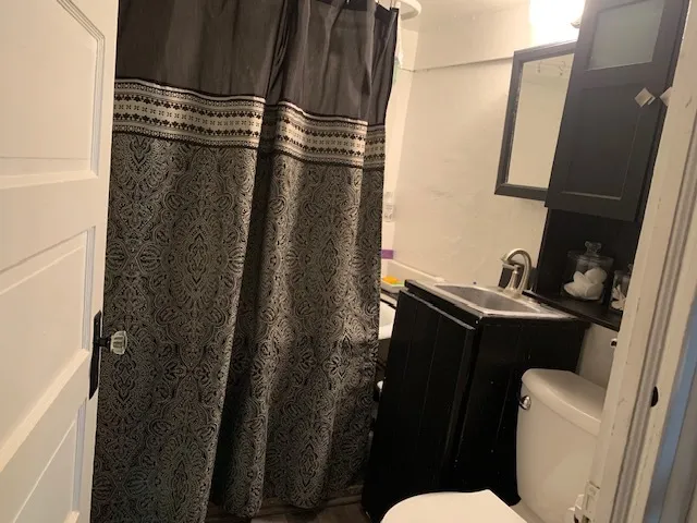 a bathroom with a sink and toilet