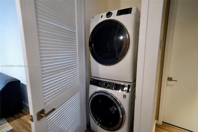 a view of a hallway with washer and dryer