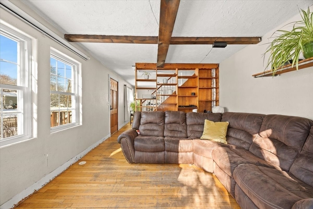45 Dorr Street Randolph, MA 02368 - Photo 11 of 28 a living room with furniture and a window