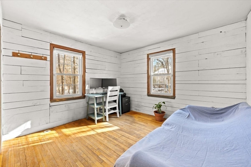 45 Dorr Street Randolph, MA 02368 - Photo 16 of 28 a bed room with a bed and a chair