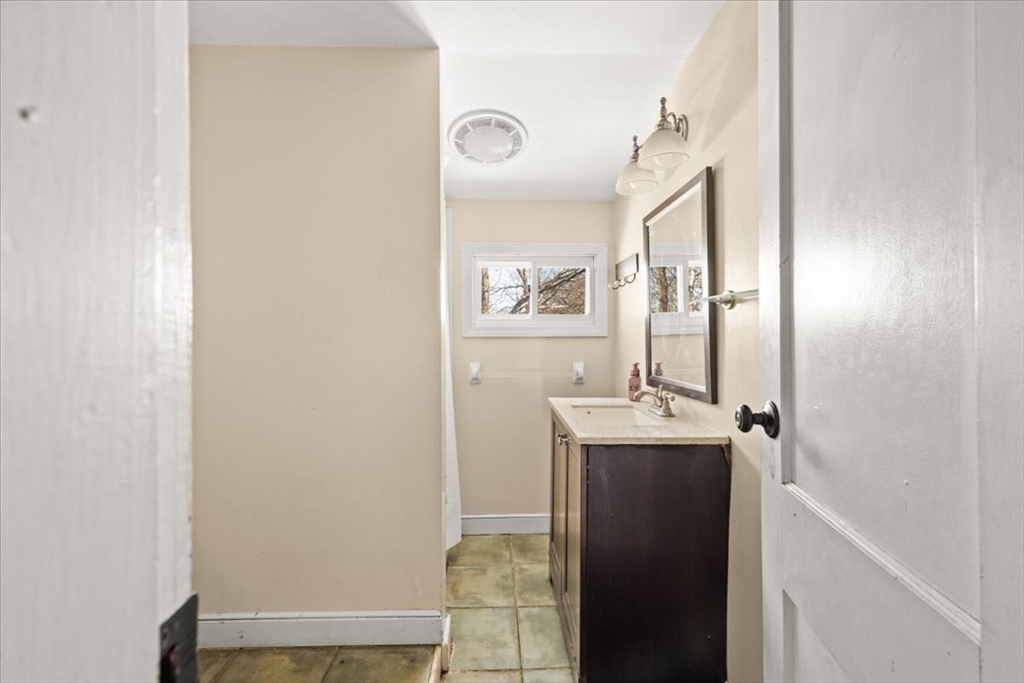 45 Dorr Street Randolph, MA 02368 - Photo 17 of 28 a bathroom with a sink mirror and toilet