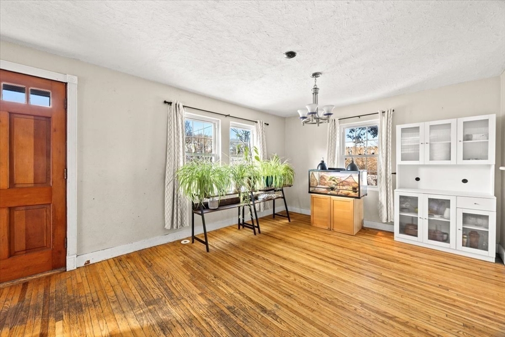 45 Dorr Street Randolph, MA 02368 - Photo 9 of 28 a living room with furniture and a wooden floor