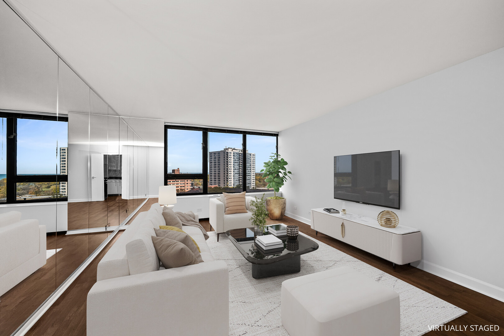 3930 North Pine Grove Avenue, Unit 1109 Chicago, IL 60613 - Photo 4 of 24 a living room with furniture and a flat screen tv