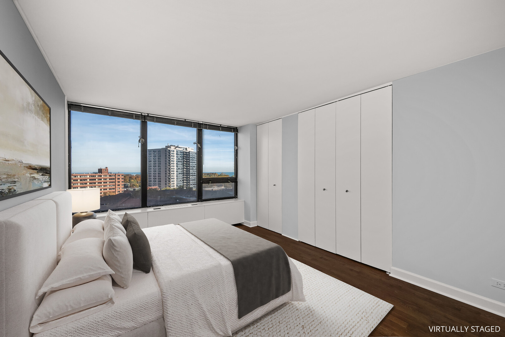 3930 North Pine Grove Avenue, Unit 1109 Chicago, IL 60613 - Photo 7 of 24 a bedroom with a bed and large window