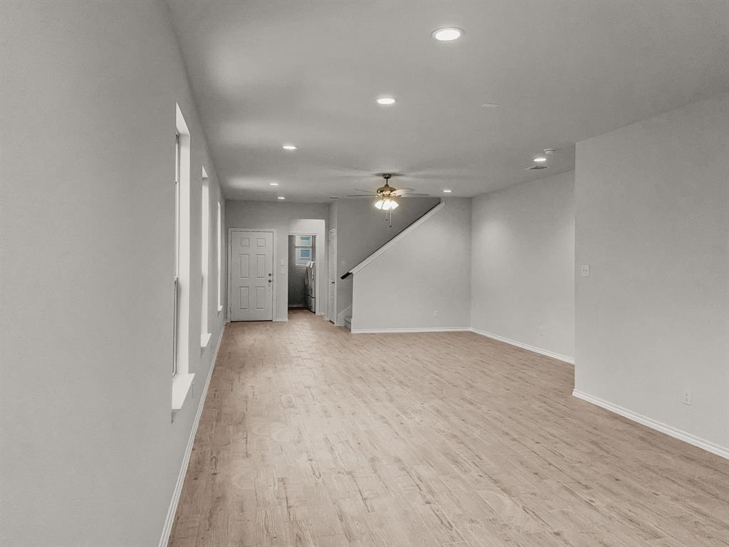 1908 Iris Road Melissa, TX 75454 - Photo 13 of 30 a view of a big room with wooden floor and windows