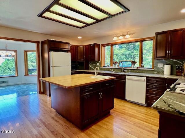 33370 Little Valley Road Fort Bragg, CA 95437 - Photo 14 of 70 a kitchen with stainless steel appliances granite countertop a stove a sink dishwasher and a refrigerator