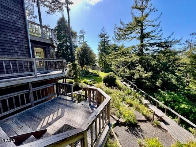 an empty room with closet and wooden door