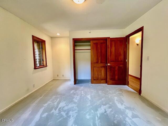 33370 Little Valley Road Fort Bragg, CA 95437 - Photo 25 of 70 an empty room with closet and wooden door