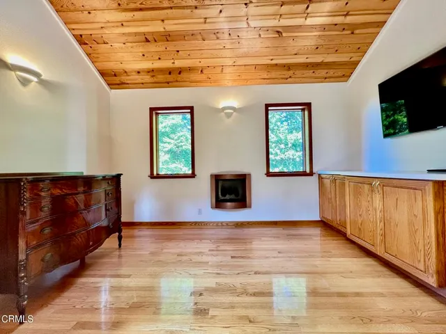 a bathroom with a sink a large mirror and a shower