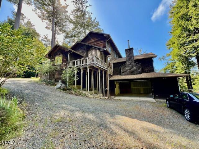 33370 Little Valley Road Fort Bragg, CA 95437 - Photo 48 of 70 a view of a house with a yard and garage