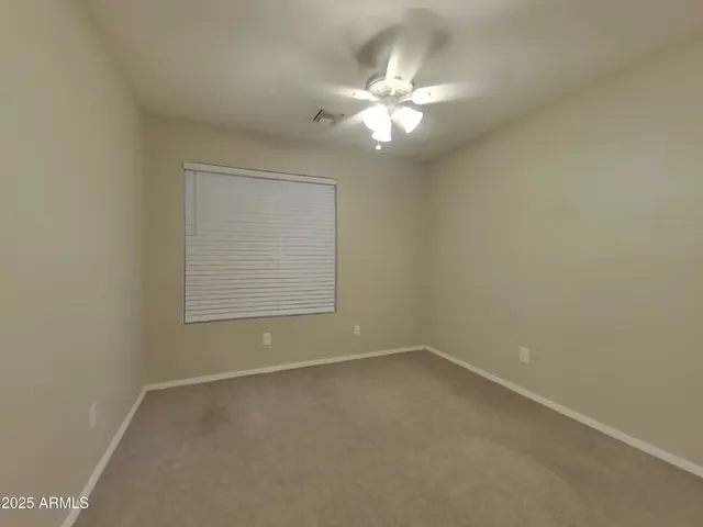 a spacious bathroom with a double vanity sink and a mirror
