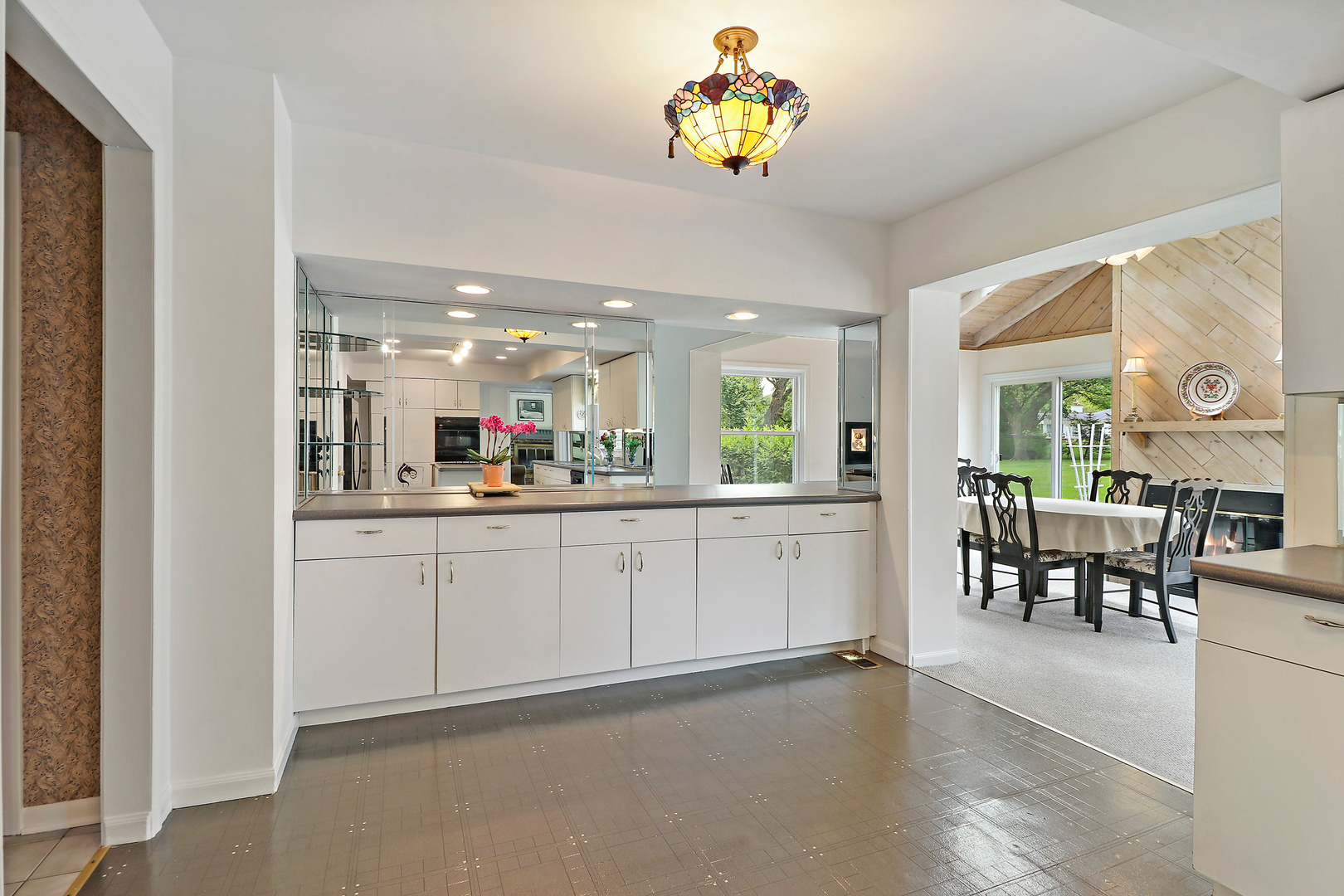400 North Valley Road Barrington, IL 60010 - Photo 12 of 30 a kitchen with a dining table chairs and view living room