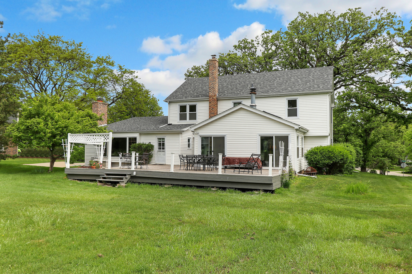 400 North Valley Road Barrington, IL 60010 - Photo 27 of 30 a front view of a house with a garden