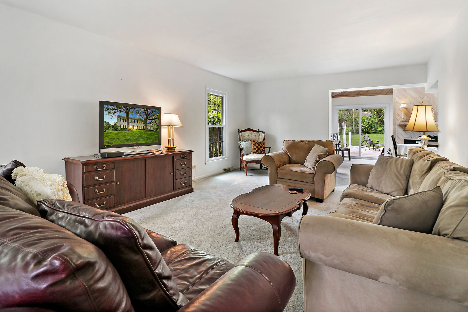 400 North Valley Road Barrington, IL 60010 - Photo 3 of 30 a living room with furniture and a flat screen tv