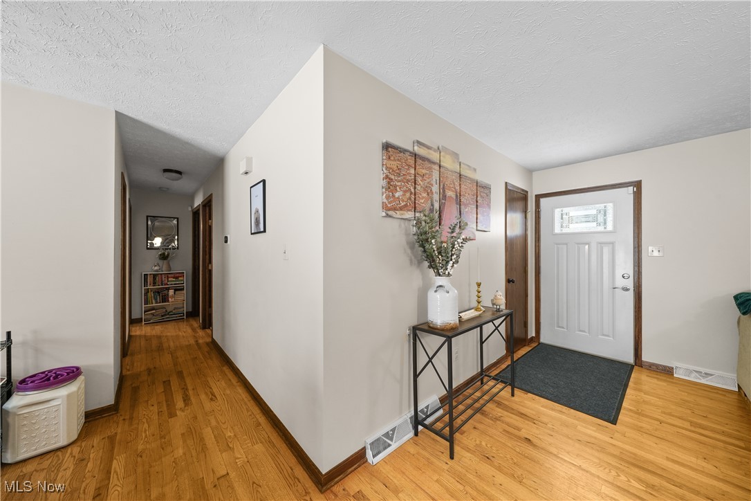 110 Judson Road Kent, OH 44240 - Photo 7 of 35 Foyer featuring a textured ceiling and light hardwood / wood-style flooring