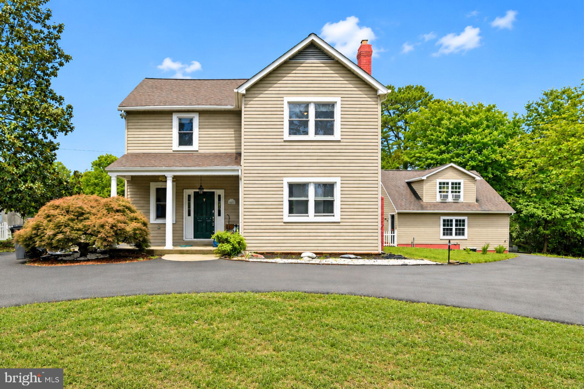 8965 Poorhouse Road Port Tobacco, MD 20677 - Photo 18 of 18 a front view of a house with a yard