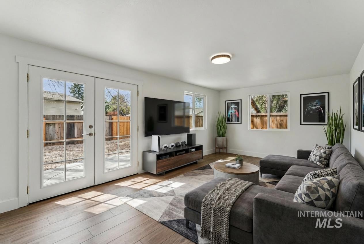 9709 West McMillan Road Boise, ID 83704 - Photo 18 of 50 Living room with wood finished floors and french doors