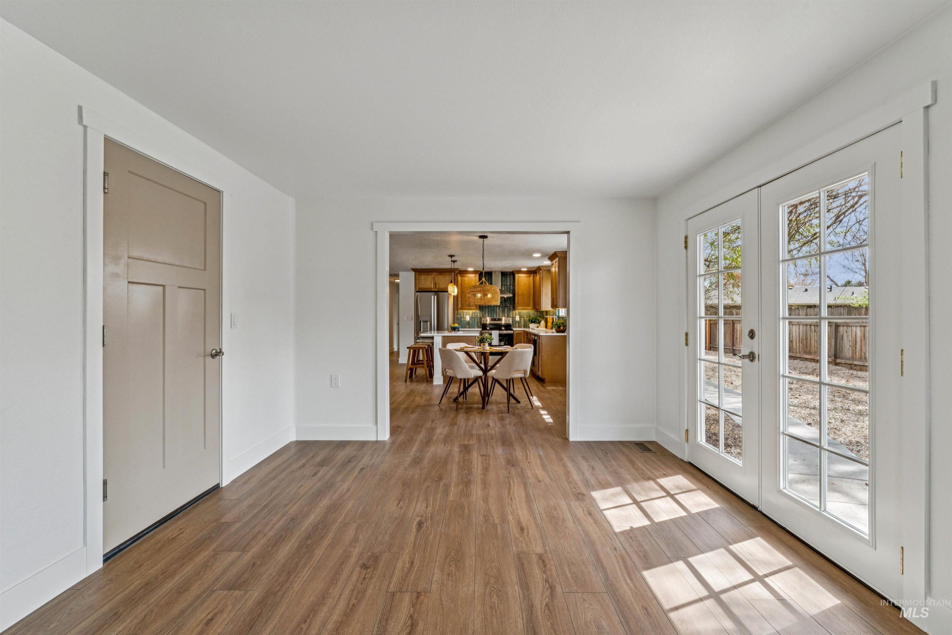 9709 West McMillan Road Boise, ID 83704 - Photo 19 of 50 Living area featuring french doors and light wood-style flooring
