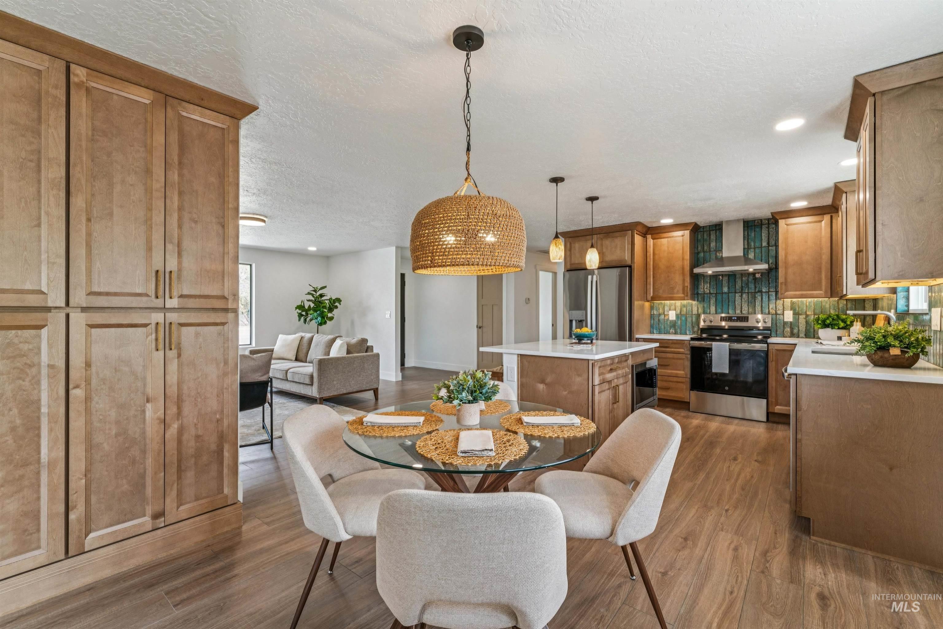 9709 West McMillan Road Boise, ID 83704 - Photo 20 of 50 Dining room featuring a textured ceiling, dark wood-style flooring, and recessed lighting