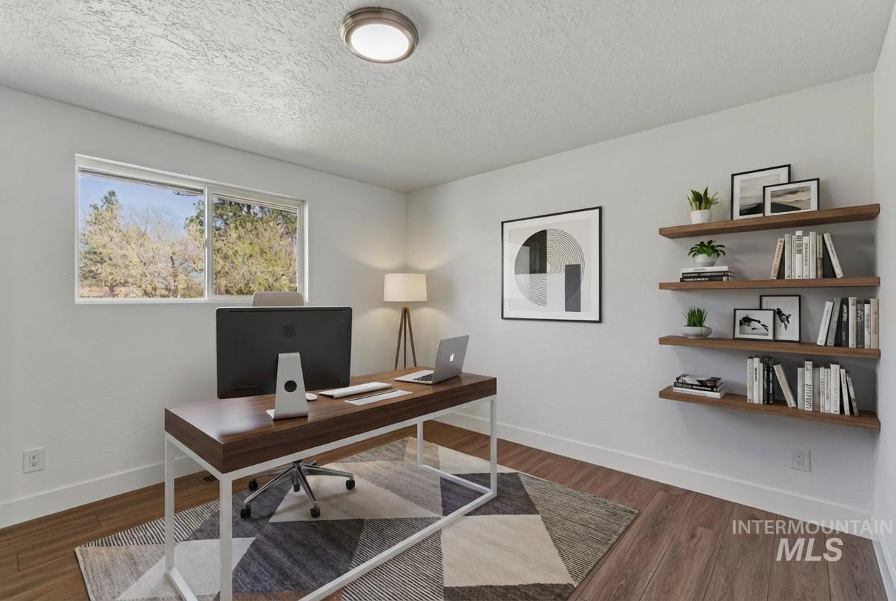 9709 West McMillan Road Boise, ID 83704 - Photo 29 of 50 Home office with wood finished floors and a textured ceiling