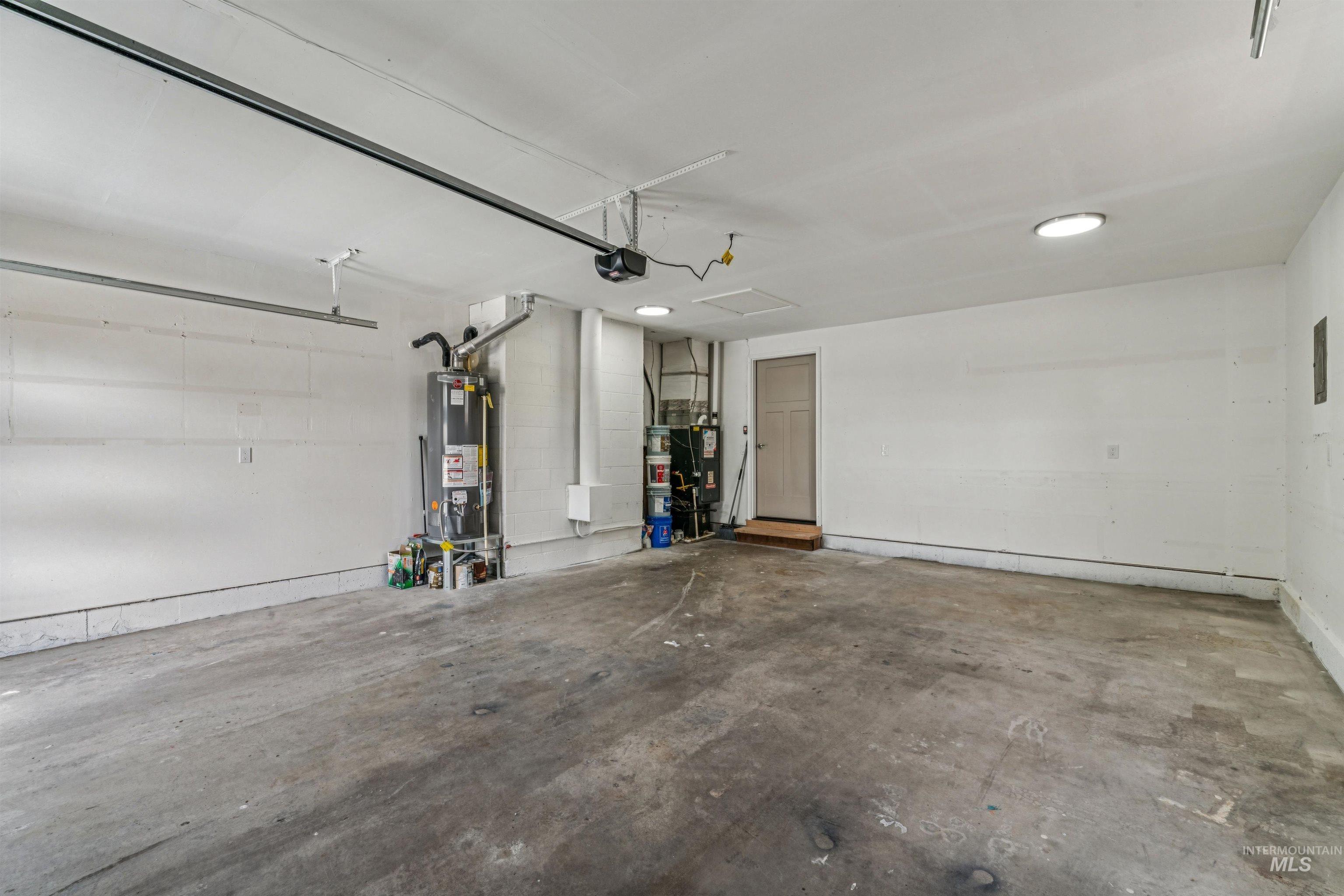 9709 West McMillan Road Boise, ID 83704 - Photo 33 of 50 Garage with water heater